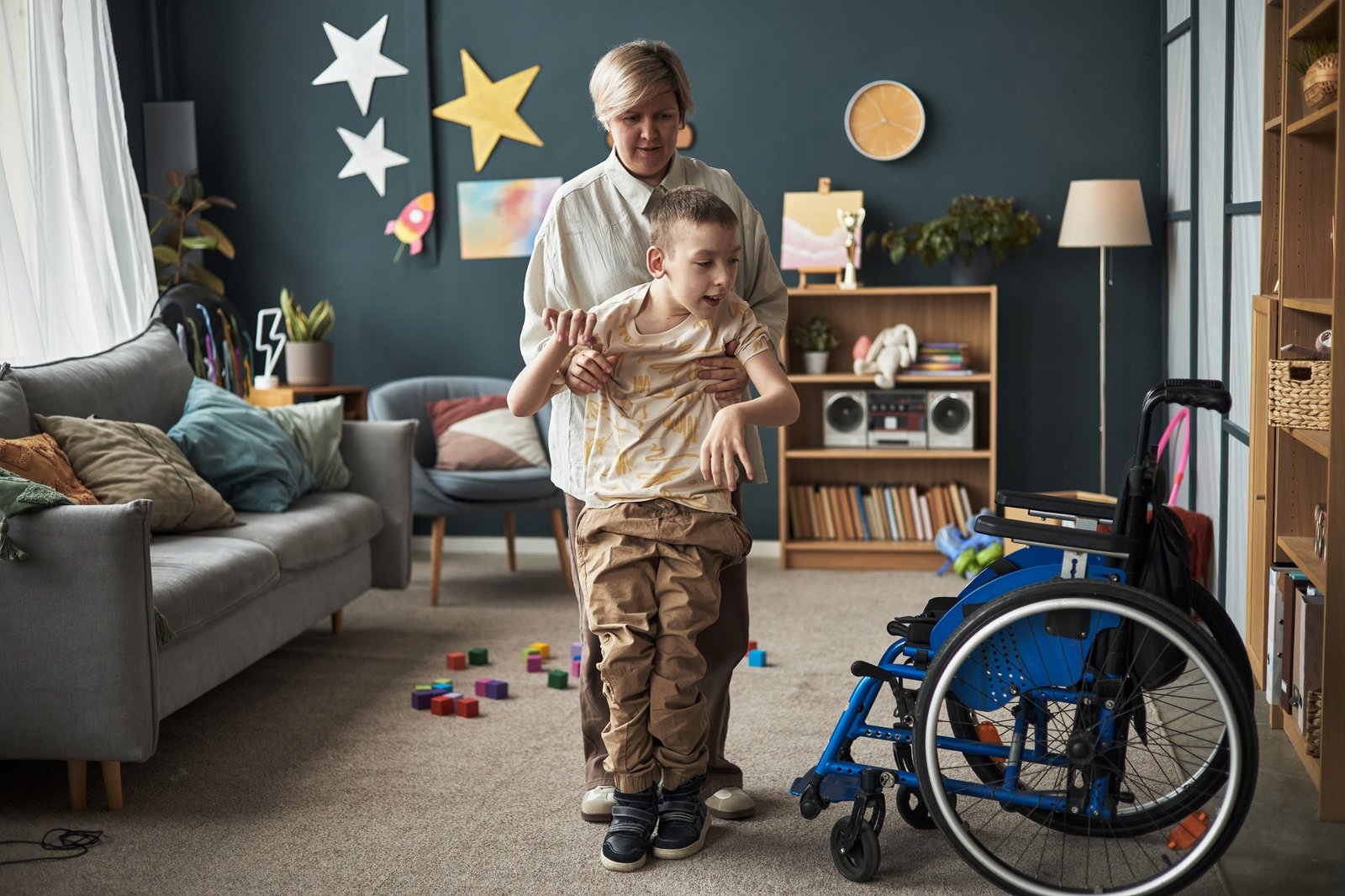 Caregiver Assisting Child with Movement in Living Room